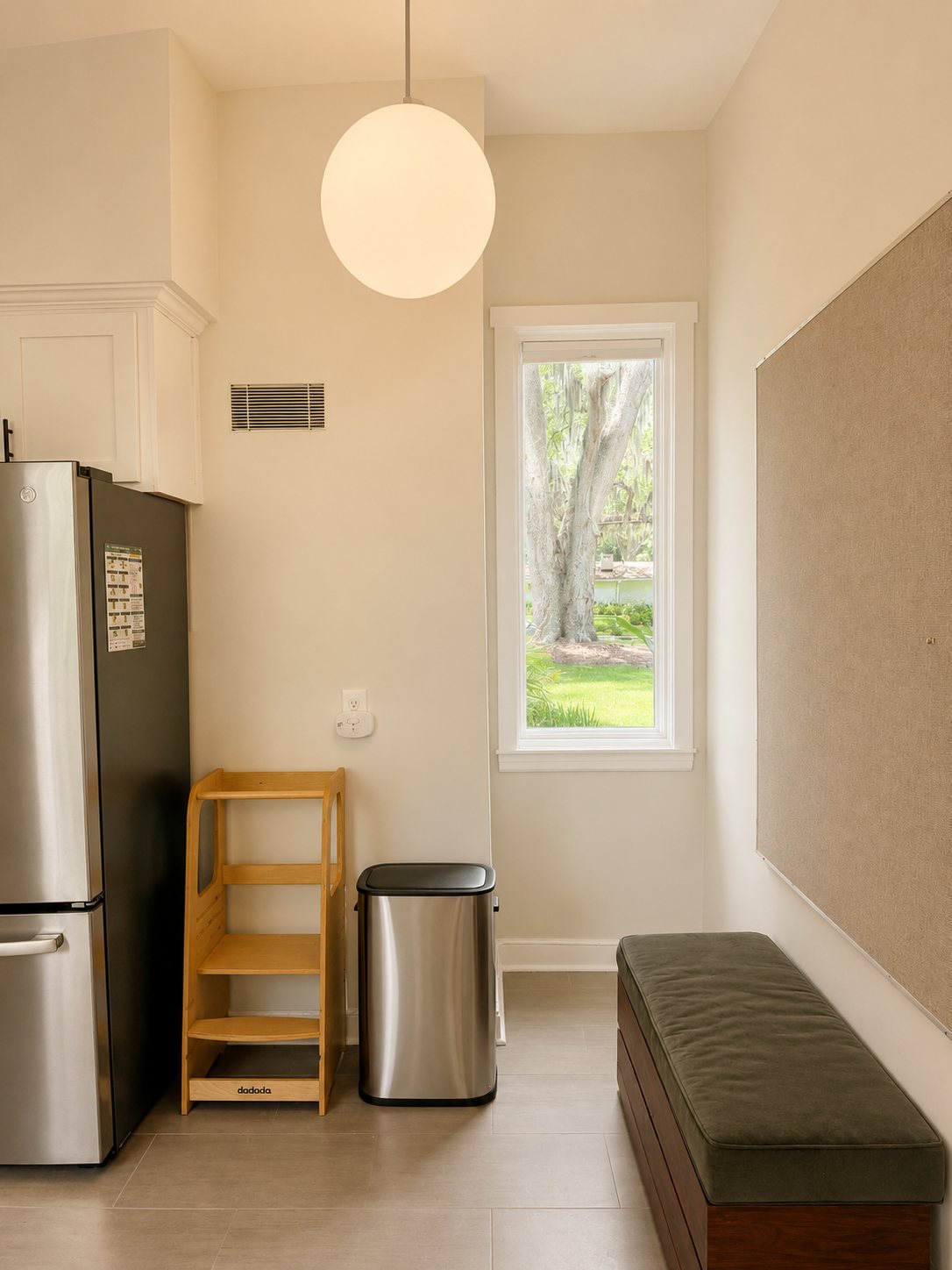 Kitchen nook with bench seat and pinboard wall