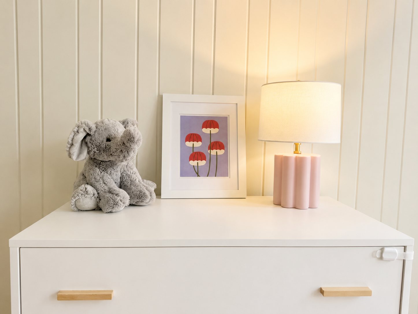 Dresser detail with framed print and lamp